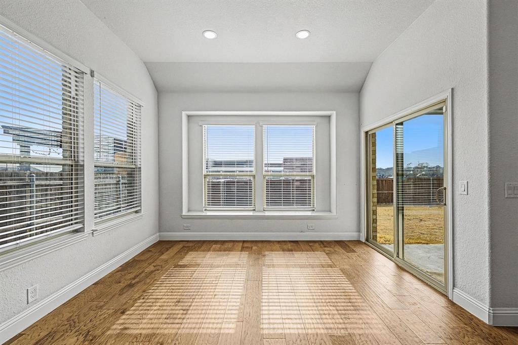 1080 Canuela Way Justin, TX 76247 - Photo 16 of 40 a view of empty room with wooden floor and fan