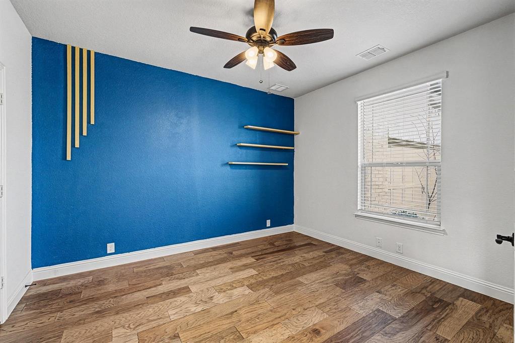 1080 Canuela Way Justin, TX 76247 - Photo 18 of 40 a view of empty room with a ceiling fan and window