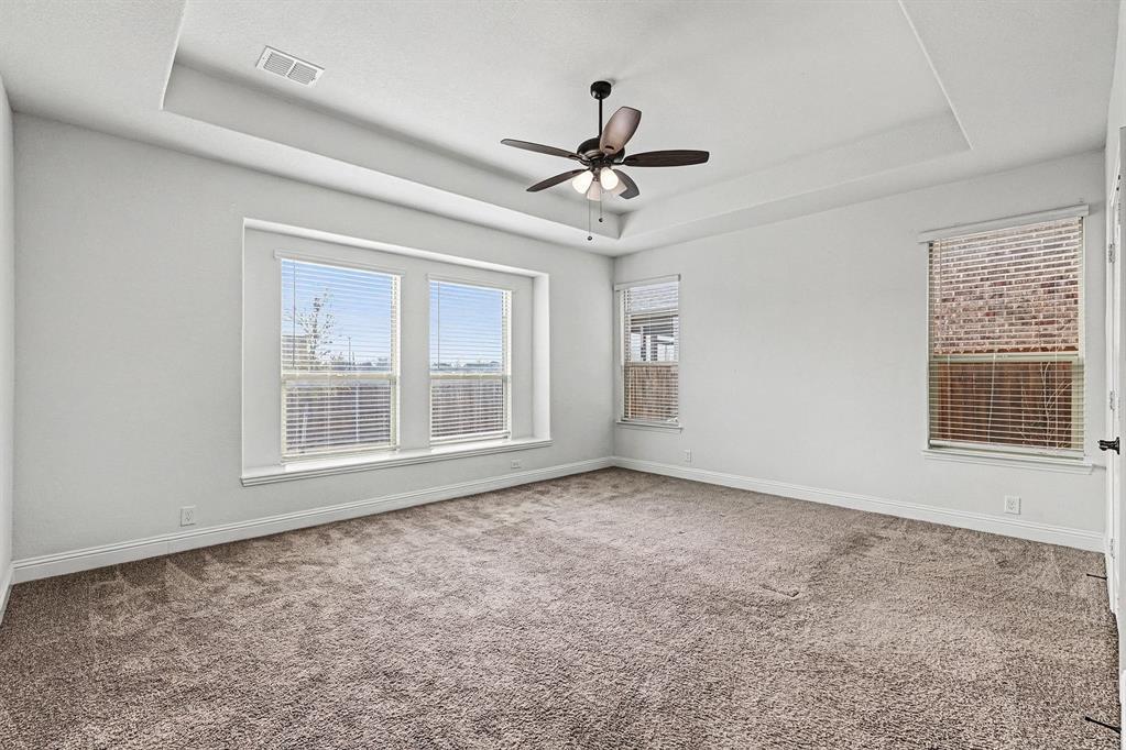 1080 Canuela Way Justin, TX 76247 - Photo 19 of 40 a view of an empty room with a window