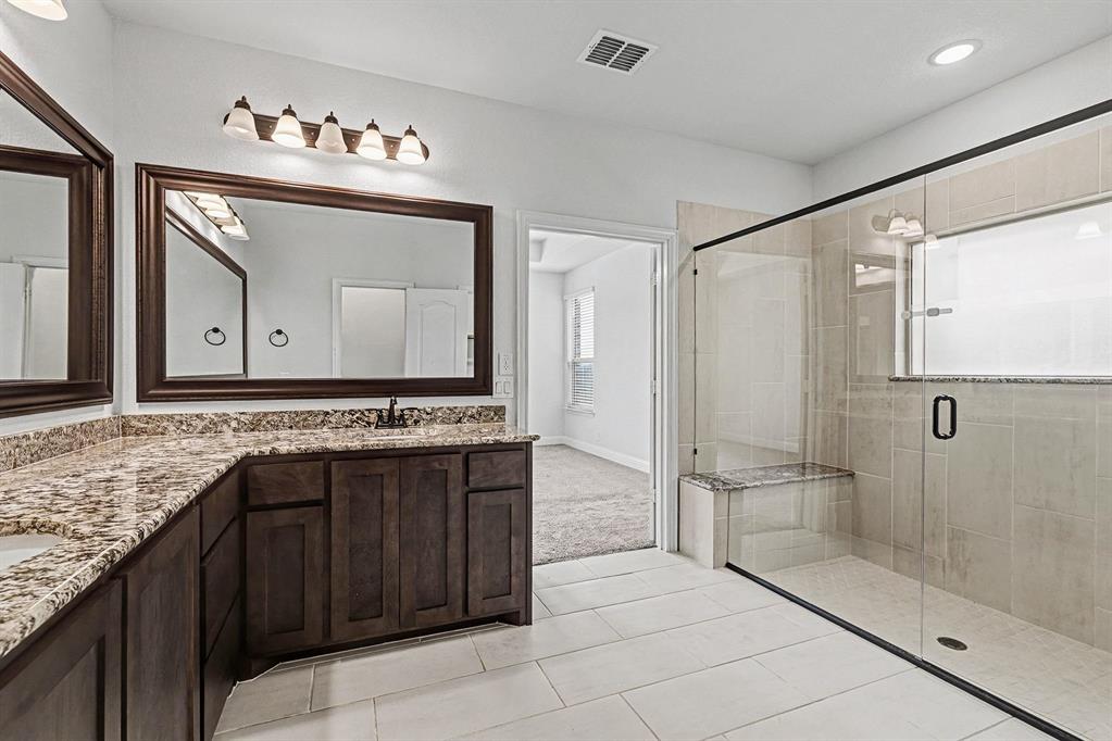 1080 Canuela Way Justin, TX 76247 - Photo 22 of 40 a bathroom with a double vanity sink mirror and shower