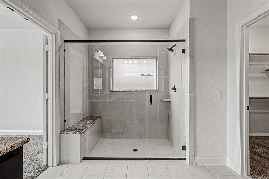 1080 Canuela Way Justin, TX 76247 - Photo 23 of 40 a bathroom with a shower and a sink