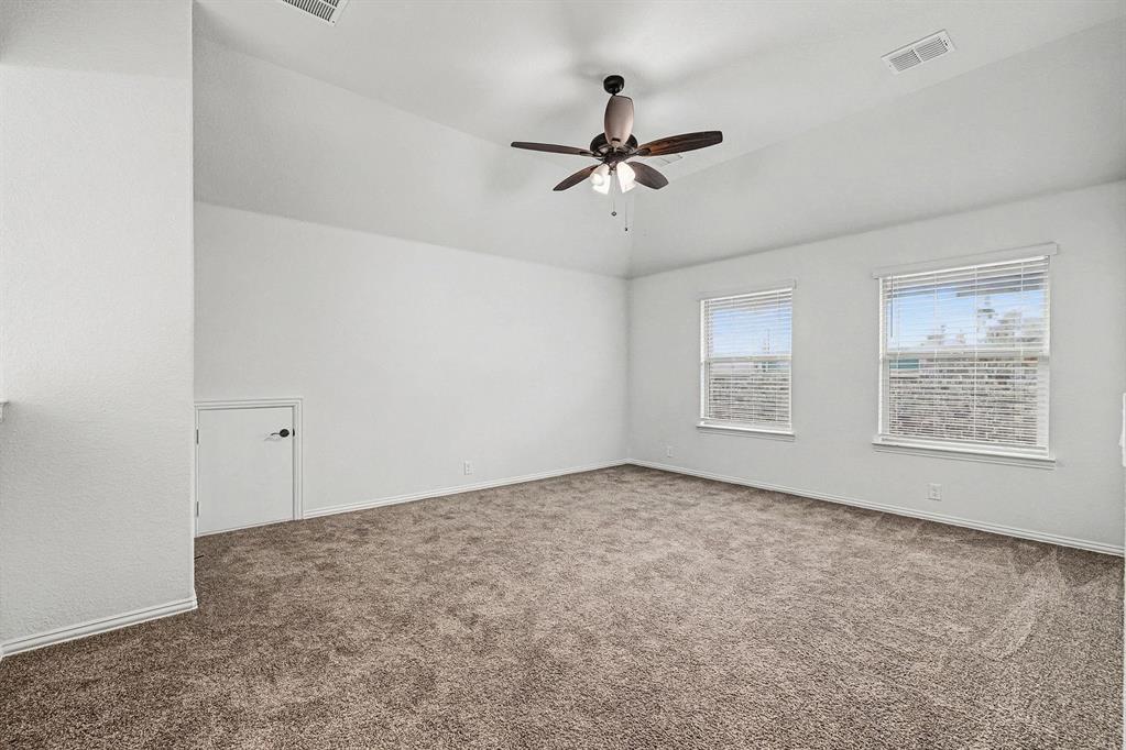 1080 Canuela Way Justin, TX 76247 - Photo 24 of 40 a view of a room with a ceiling fan and window