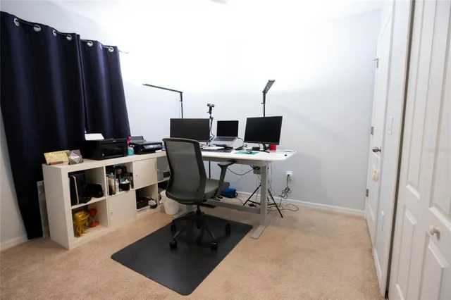 a view of a workspace with furniture