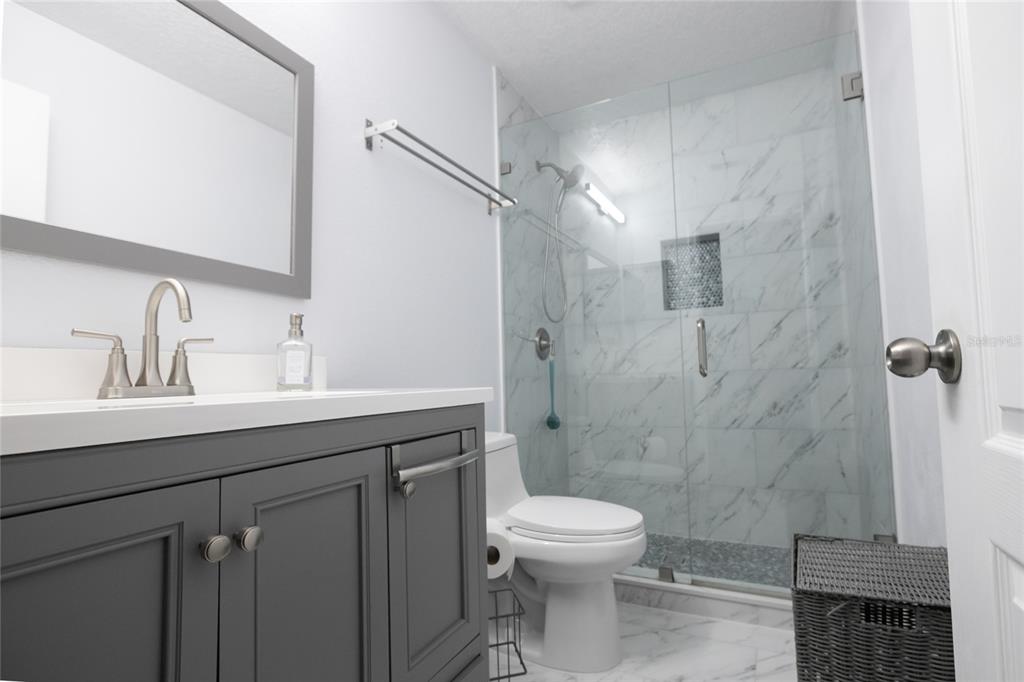 1185 Seburn Road Apopka, FL 32703 - Photo 36 of 47 a bathroom with a sink toilet and shower