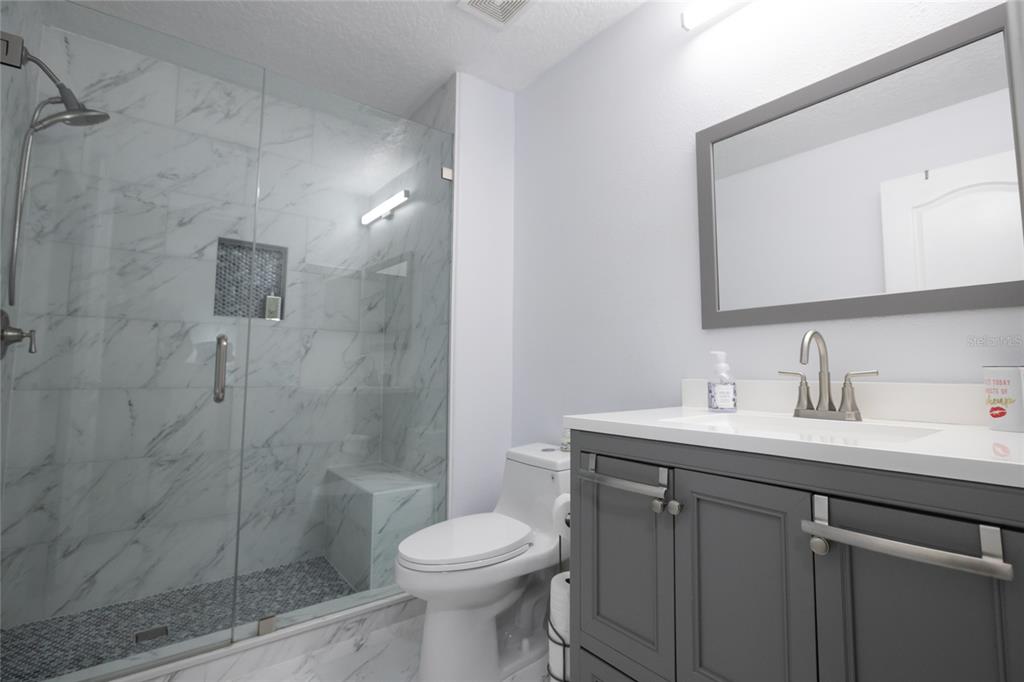 1185 Seburn Road Apopka, FL 32703 - Photo 37 of 47 a bathroom with a sink a toilet and shower