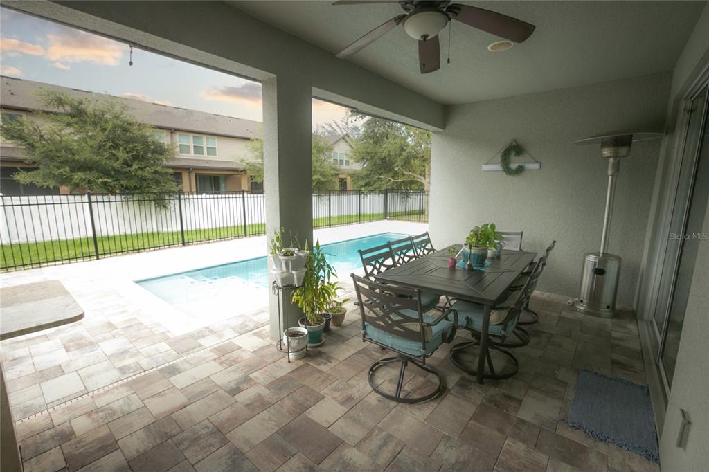 1185 Seburn Road Apopka, FL 32703 - Photo 42 of 47 a view of a patio with table and chairs and potted plants