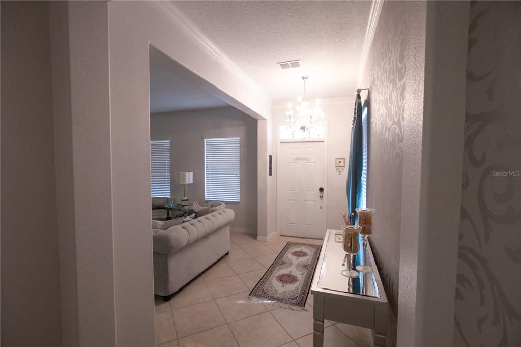 1185 Seburn Road Apopka, FL 32703 - Photo 9 of 47 a living room with furniture and a flat screen tv