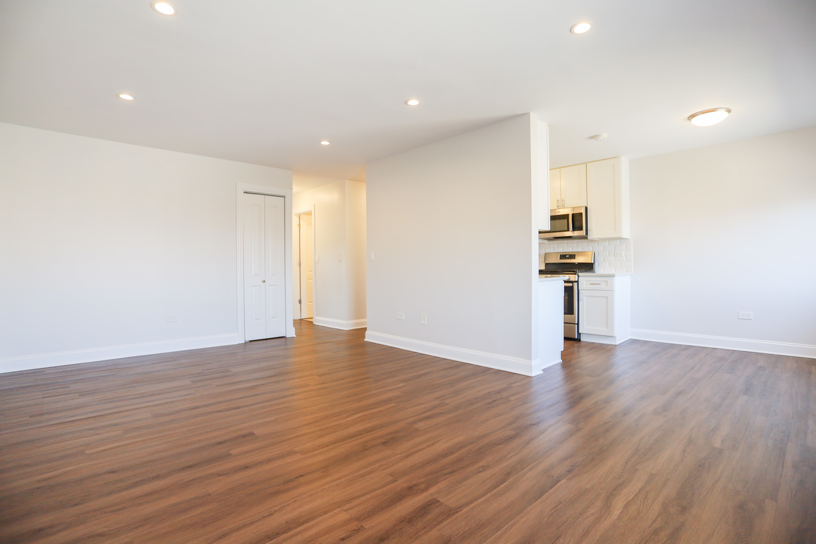 8651 West Foster Avenue, Unit 3A Chicago, IL 60656 - Photo 16 of 17 a view of empty room with wooden floor