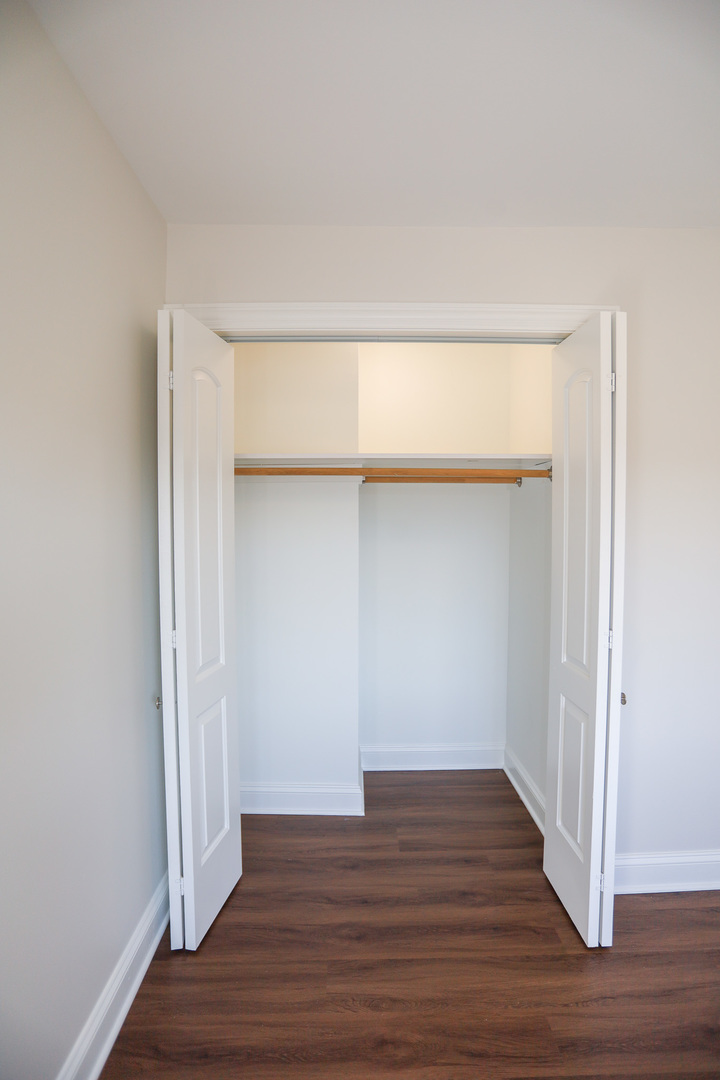 8651 West Foster Avenue, Unit 3A Chicago, IL 60656 - Photo 5 of 17 a view of an empty room with wooden floor