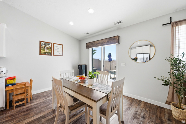 1175 Silver Hollow Road Syracuse, UT 84075 - Photo 14 of 34 Dining area featuring wood-finish flooring, a sliding glass door, recessed lighting, and a neutral wall color