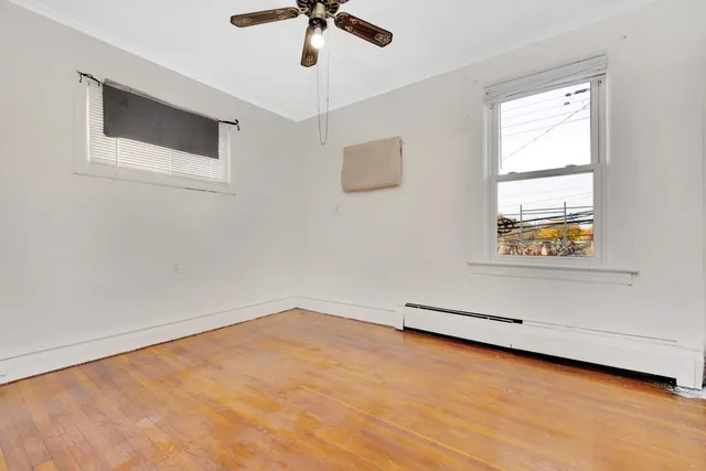 a bathroom with a toilet a sink and shower