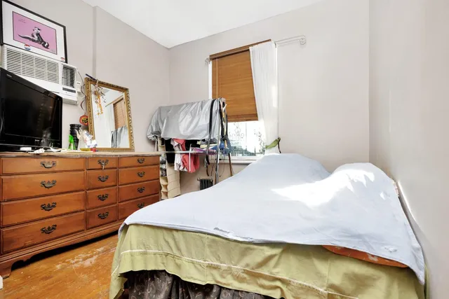 a bathroom with a sink toilet and a mirror