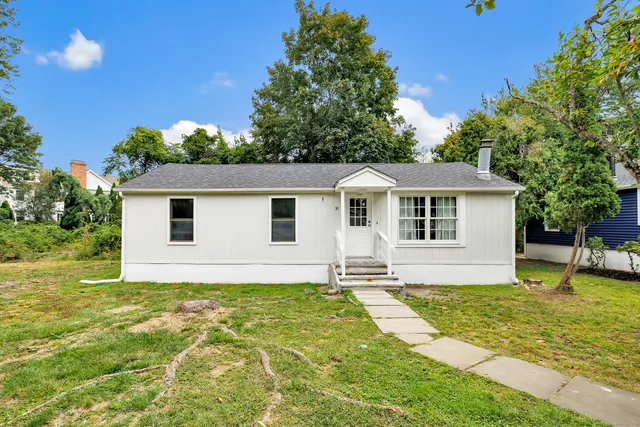a house view with a garden space