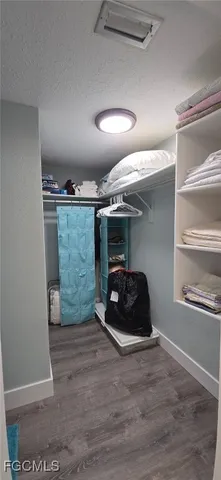 a room with wooden floor and window