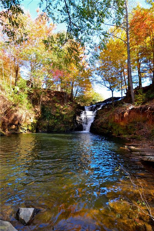 Lot671 Valley View Trail Jasper, GA 30143 - Photo 30 of 32 a lake view with boat and trees