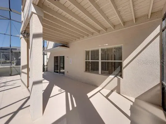 a swimming pool with an outdoor seating