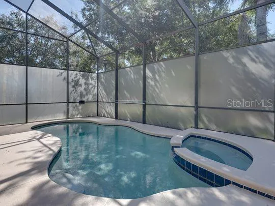 a view of a swimming pool with a patio