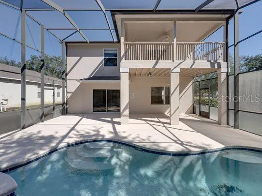 a view of a swimming pool with chairs