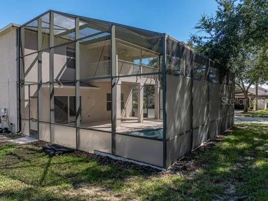 a view of a house with trees in front of it