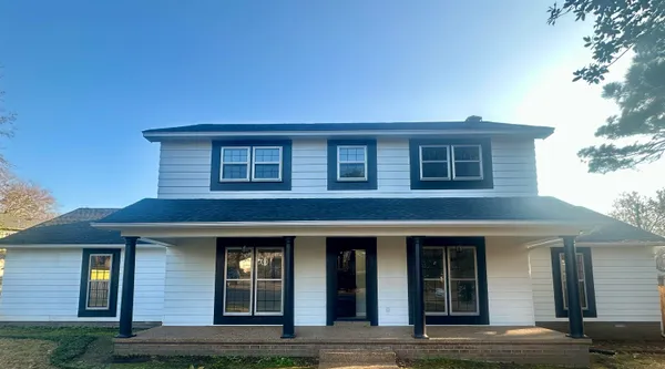 a front view of a house with yard