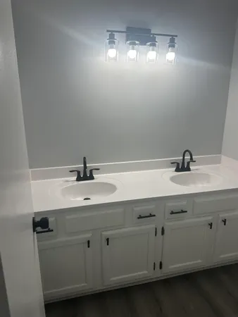 a bathroom with a sink and a mirror