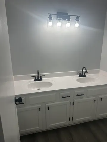 a bathroom with a sink and a mirror