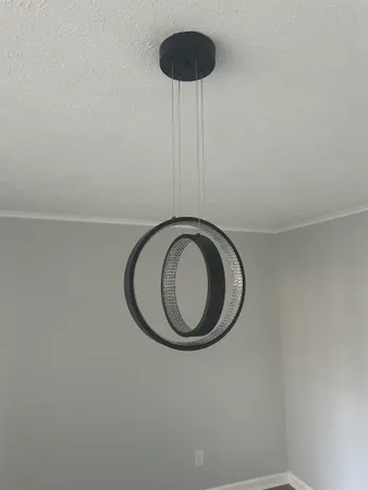 a view of a room with a sink and a mirror