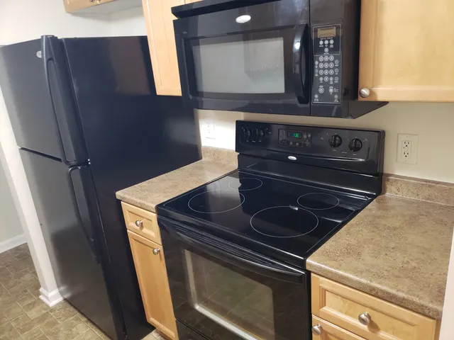 a stove top oven sitting inside of a kitchen