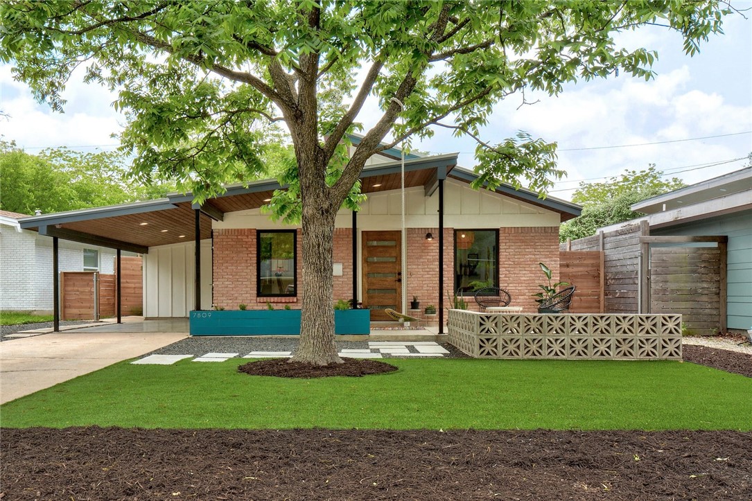 front view of a house with a yard