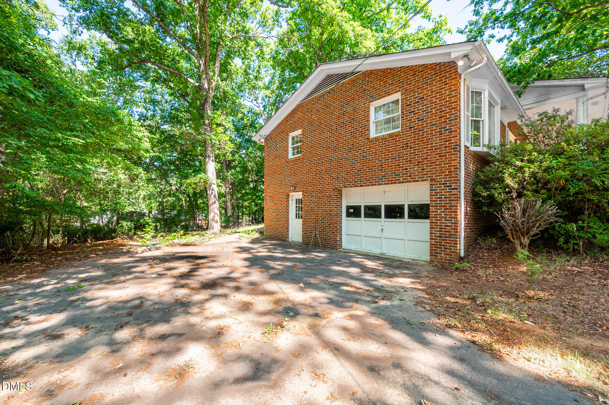 4411 Rhew Drive Durham, NC 27704 - Photo 3 of 34 a front view of a house with a yard
