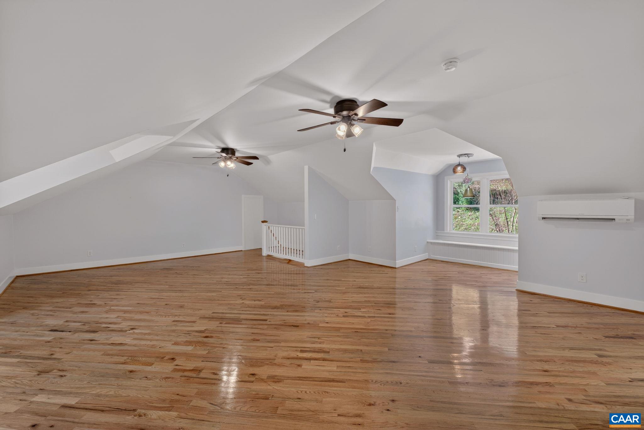 689 Mutton Hollow Road Stanardsville, VA 22973 - Photo 54 of 61 a view of empty room with wooden floor and fan