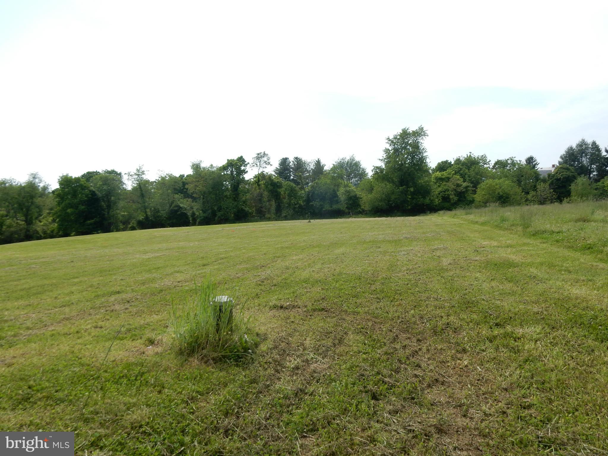 9547 Liberty Road Frederick, MD 21701 - Photo 14 of 18 a view of a field with trees in the background