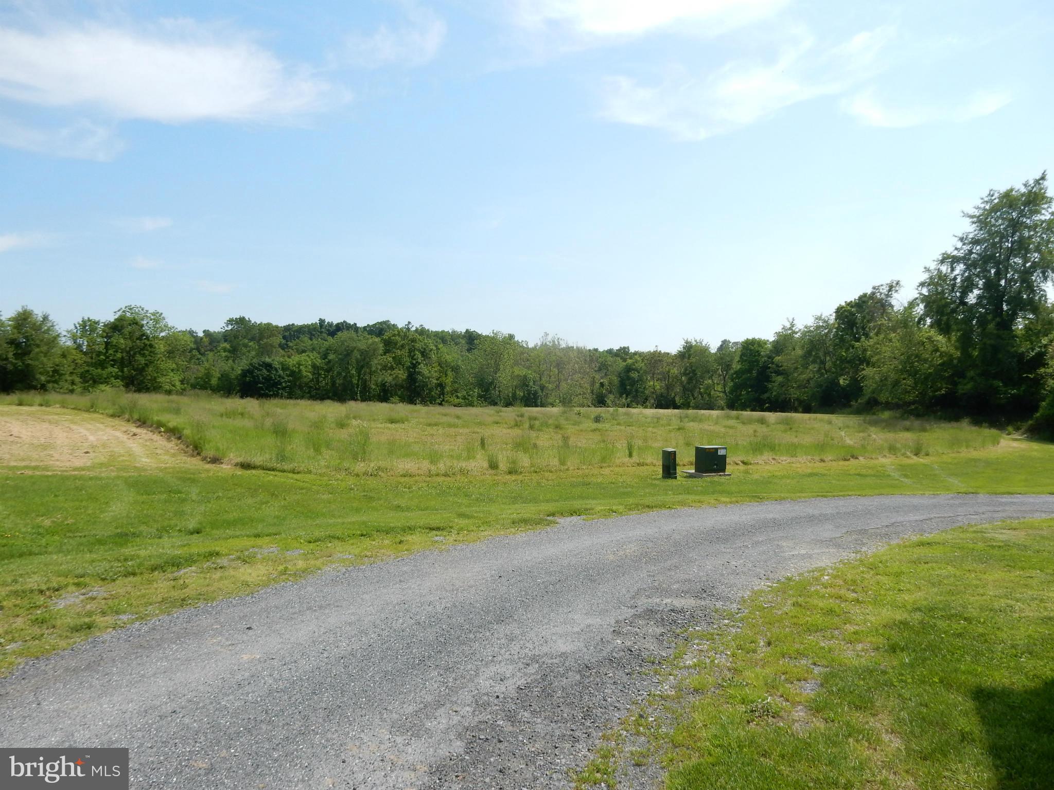 9547 Liberty Road Frederick, MD 21701 - Photo 4 of 18 a view of a field with a big yard