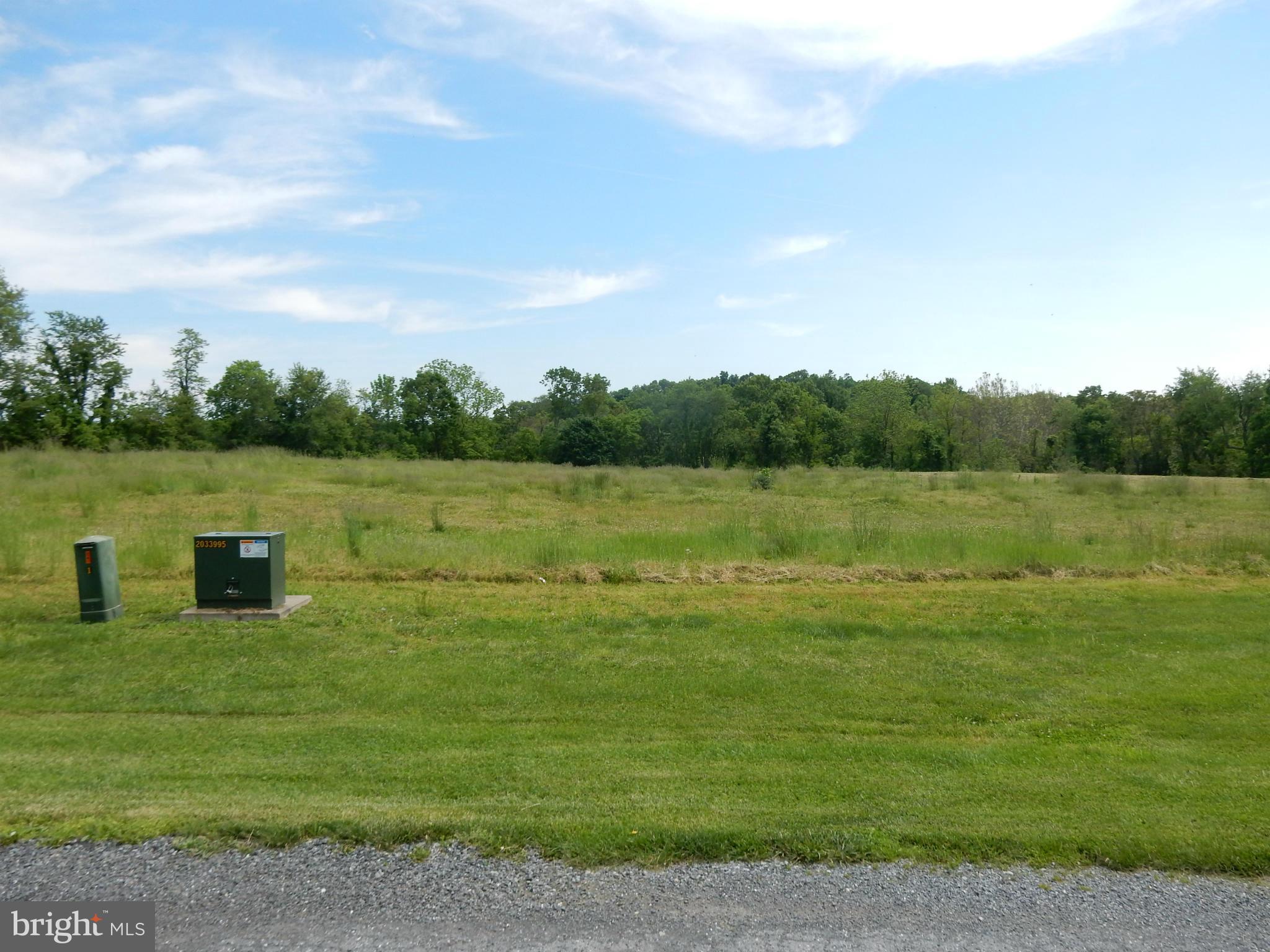 9547 Liberty Road Frederick, MD 21701 - Photo 5 of 18 a view of a lake with houses in the back