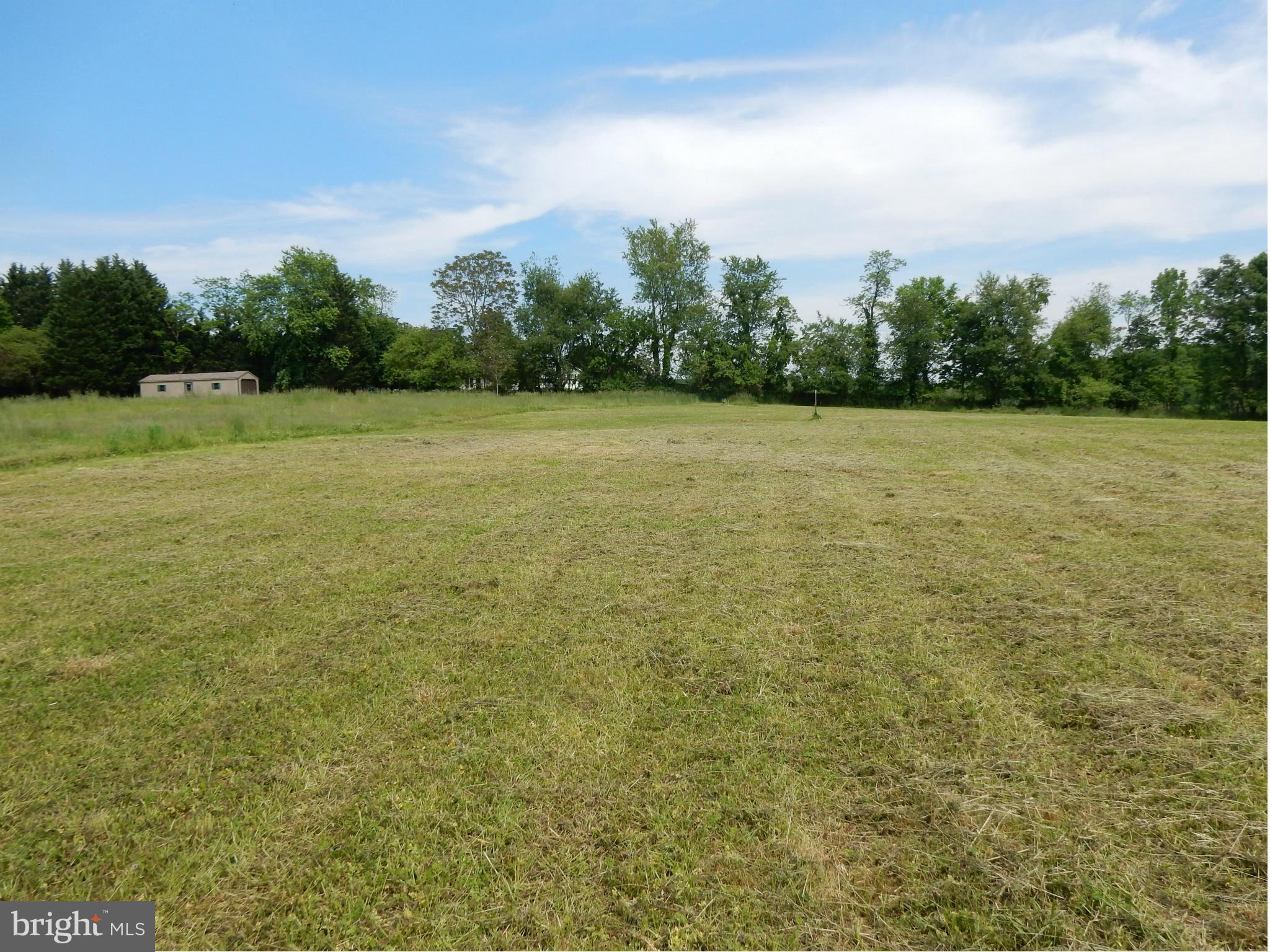 9547 Liberty Road Frederick, MD 21701 - Photo 6 of 18 a view of a field with trees in the background