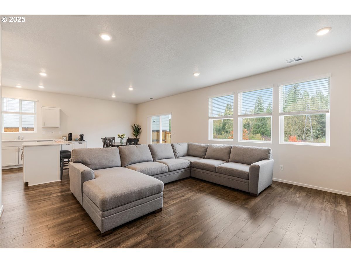 3499 Southeast Paropa Avenue Gresham, OR 97080 - Photo 11 of 48 a living room with furniture and windows