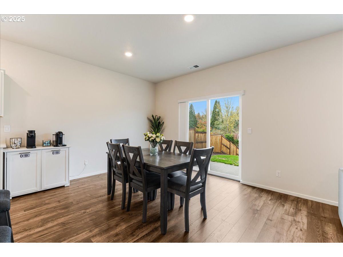 3499 Southeast Paropa Avenue Gresham, OR 97080 - Photo 16 of 48 a view of a dining room with furniture and wooden floor