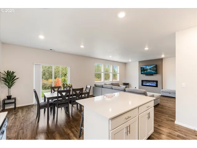 a kitchen with stainless steel appliances a sink stove and microwave