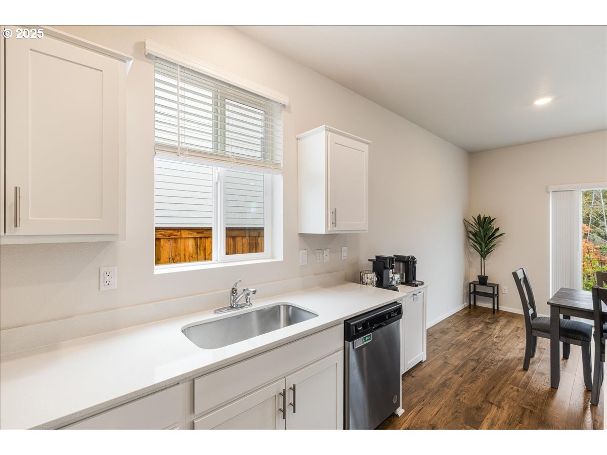 3499 Southeast Paropa Avenue Gresham, OR 97080 - Photo 24 of 48 a kitchen that has a sink and a chair in it