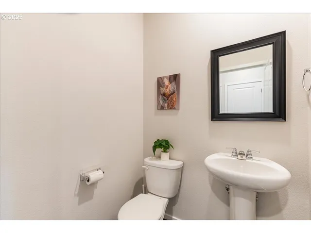 a bathroom with a sink toilet tub and shower