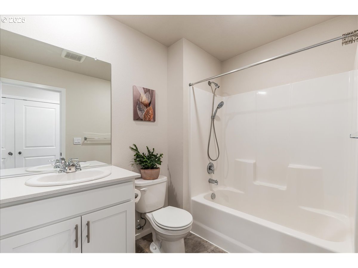 3499 Southeast Paropa Avenue Gresham, OR 97080 - Photo 26 of 48 a bathroom with a sink toilet tub and shower