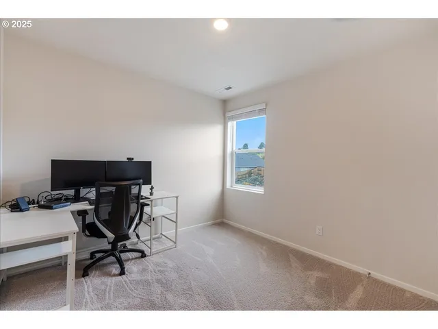 a view of room with wooden floor
