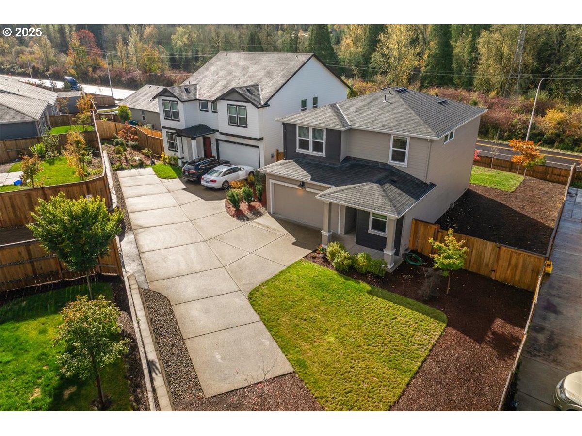 3499 Southeast Paropa Avenue Gresham, OR 97080 - Photo 4 of 48 a aerial view of a house with table and chairs