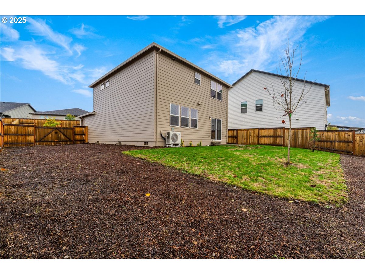 3499 Southeast Paropa Avenue Gresham, OR 97080 - Photo 42 of 48 a view of a house with a yard