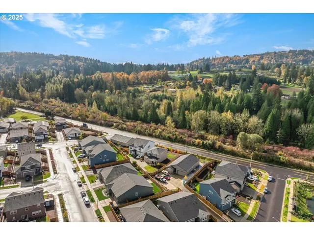 an aerial view of residential building and ocean view
