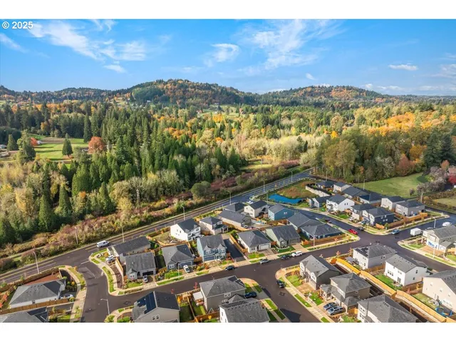 an aerial view of residential building and ocean