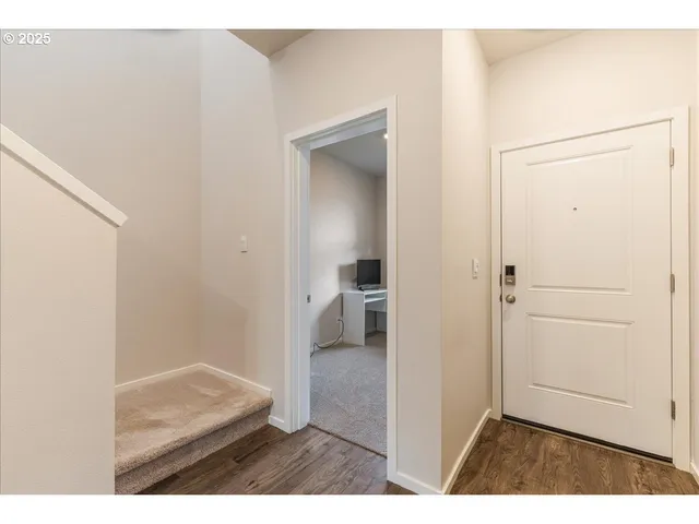 a living room with furniture a rug and a window