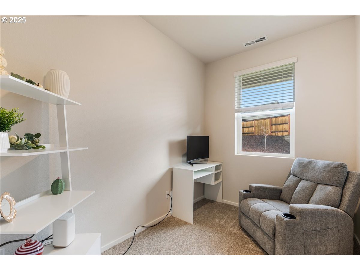 3499 Southeast Paropa Avenue Gresham, OR 97080 - Photo 9 of 48 a living room with furniture a rug and a window