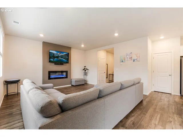 a living room with furniture and windows
