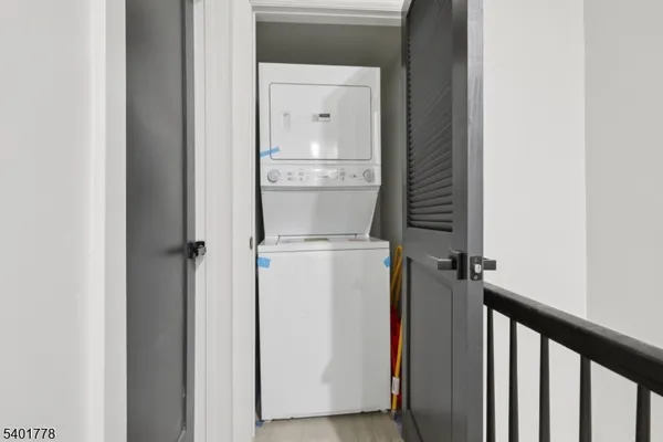 a view of storage and utility room with washer and dryer